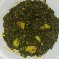 A picture of 3 spice alu daal palak.