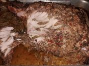 Una foto de carne de pernil