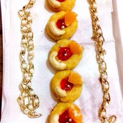 A picture of Orange (cashew) kaju sandesh.