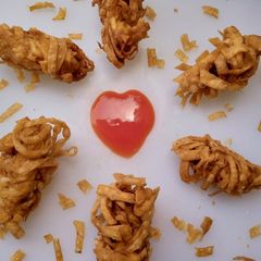 A picture of Thread wrapped chicken strips.