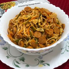 A picture of Schezwan Egg Sausage Noodles.