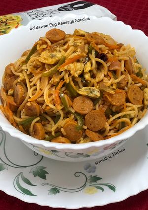 A picture of Schezwan Egg Sausage Noodles.