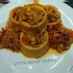 A picture of Moi moi wt cabbage sauce.