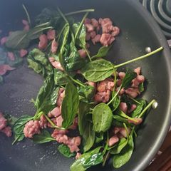 Fried bacon and baby spinach A picture of Fried bacon and baby spinach.