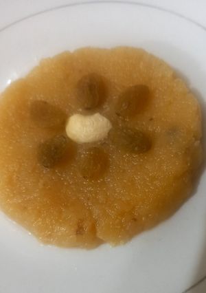 A picture of Besan halwa with fresh cream.