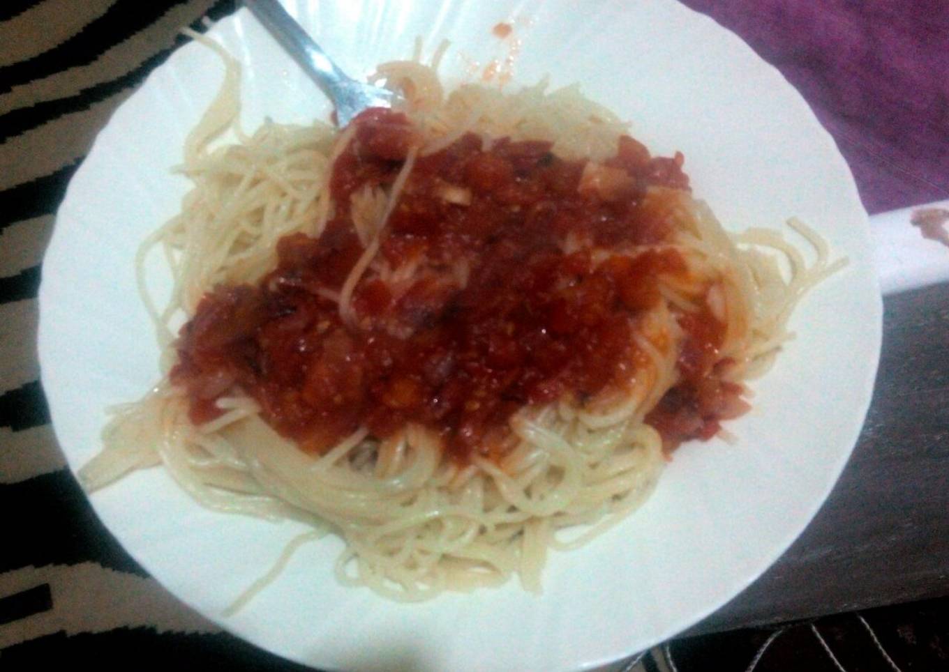 Spaghetti served with tomato soup