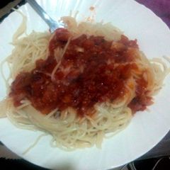 A picture of Spaghetti served with tomato soup.