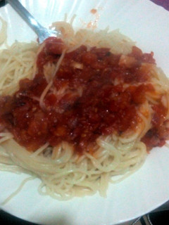 A picture of Spaghetti served with tomato soup.