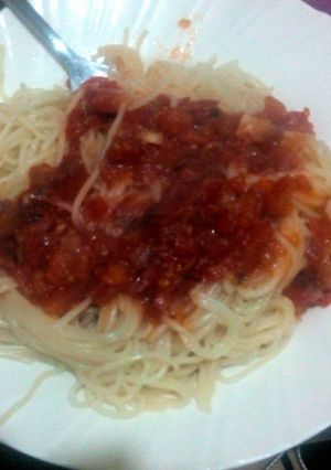 A picture of Spaghetti served with tomato soup.