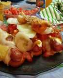 Panchos (frankfruter) con pan de Viena, verdura y fruta