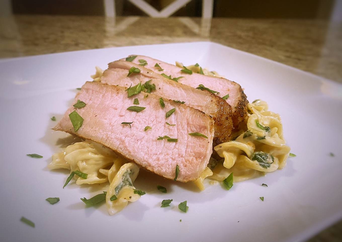 Pork chops with lemon garlic and spinach cream pasta