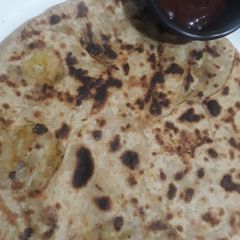 A picture of Aloo mattar cheese paratha.