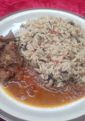 A picture of Rice and beans with pepper soup.
