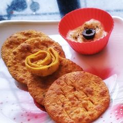 A picture of Pizza puri with cheesy dip.