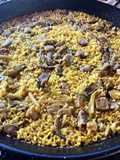 Paella with Secreto Pork, Mushrooms, and Green Garlic