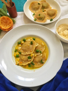 A picture of Besan raviolis with sweet and tangy sauce.