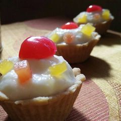A picture of Mixed fruit rice kheer tarts.