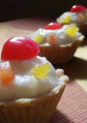 A picture of Mixed fruit rice kheer tarts.