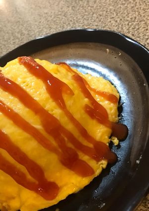 A picture of Omurice ~Japanese Style Rice Omelette~.