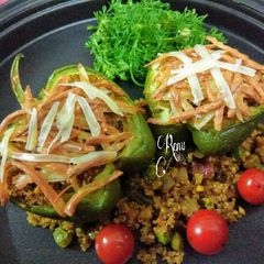 A picture of Quinoa Stuffed Cheesy Capsicum (Baked).