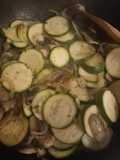 Salmon fillets with courgettes onion and mushrooms