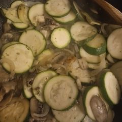 Salmon fillets with courgettes onion and mushrooms A picture of Salmon fillets with courgettes onion and mushrooms.