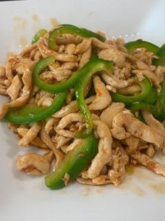 A picture of Chinese style Stir-Fry Containing Green pepper and Meat.
