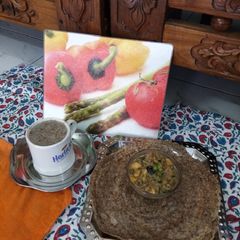 A picture of Ragi Dosa with Salad Curry and Ragi Coffee.