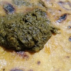 A picture of Makai ki roti with saag.