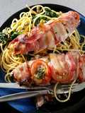 Bacon - wrapped fish with spaghetti