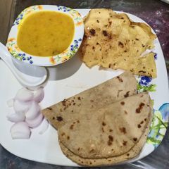 A picture of Tadka dal with Roti.