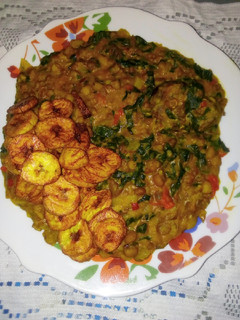 A picture of Honey Beans Jollof and Fried Plaintain.