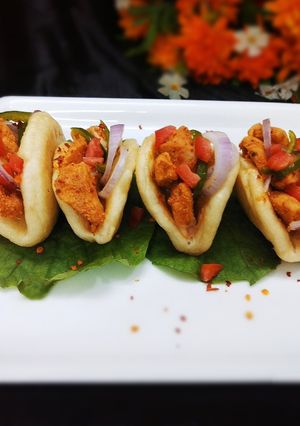 A picture of Chicken bao in indian style.