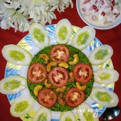 A picture of Spinach Rice/HariyaliRice with Raita.