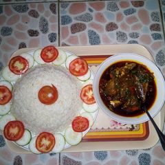 A picture of White rice with spinach source.