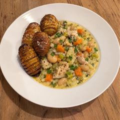 A picture of Healthy High-Protein Chicken Stew with Crispy Hasselback Potatoes.