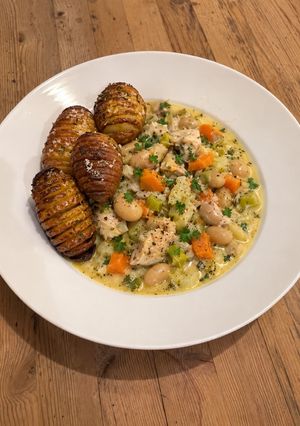 A picture of Healthy High-Protein Chicken Stew with Crispy Hasselback Potatoes.