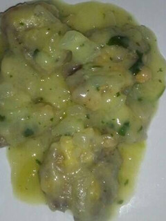 Una foto de Lengua de cerdo encebollada