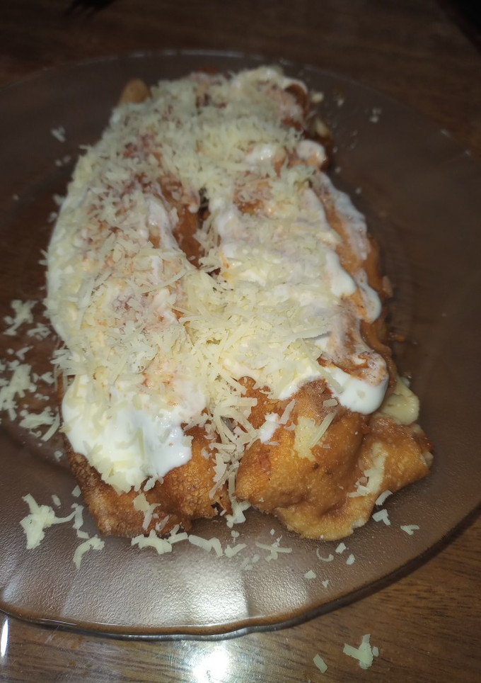 Una foto de Canelones de ricota, espinaca y jamón