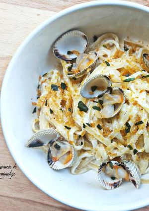 Une photo de Linguines crémeux coques, citron et poutargue