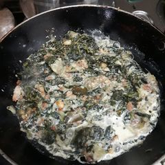 A picture of Vagi saag with badi, brinjal, pumpkins and milk.
