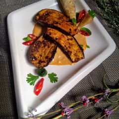 A picture of Mediterranean brinjals with special tahina dynamite sauce.