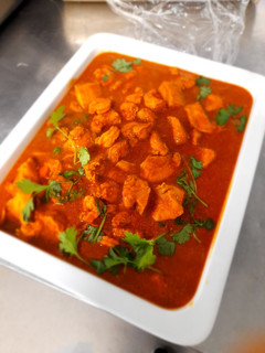 A picture of Chicken and prawn curry.