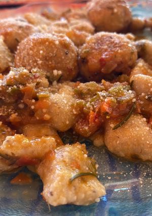 A picture of Potato Gnocchi with Basil and Parsley.