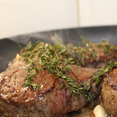 A picture of Filet Steak with Garlic and Thyme Butter.