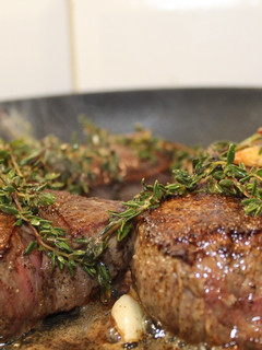A picture of Filet Steak with Garlic and Thyme Butter.
