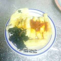 A picture of Fried yam, omelette and stir-fry leafy vegetables.