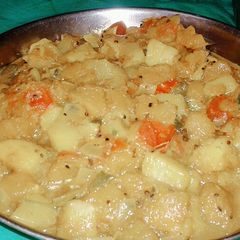 A picture of Potatoes and pumpkin fry.