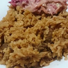 A picture of Beef Pilau and kachumbari.