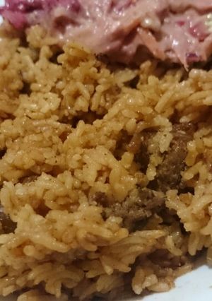 A picture of Beef Pilau and kachumbari.